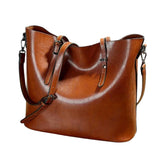 GRETA™ – MALA DE OMBRO EM COURO COM AURA CLÁSSICA